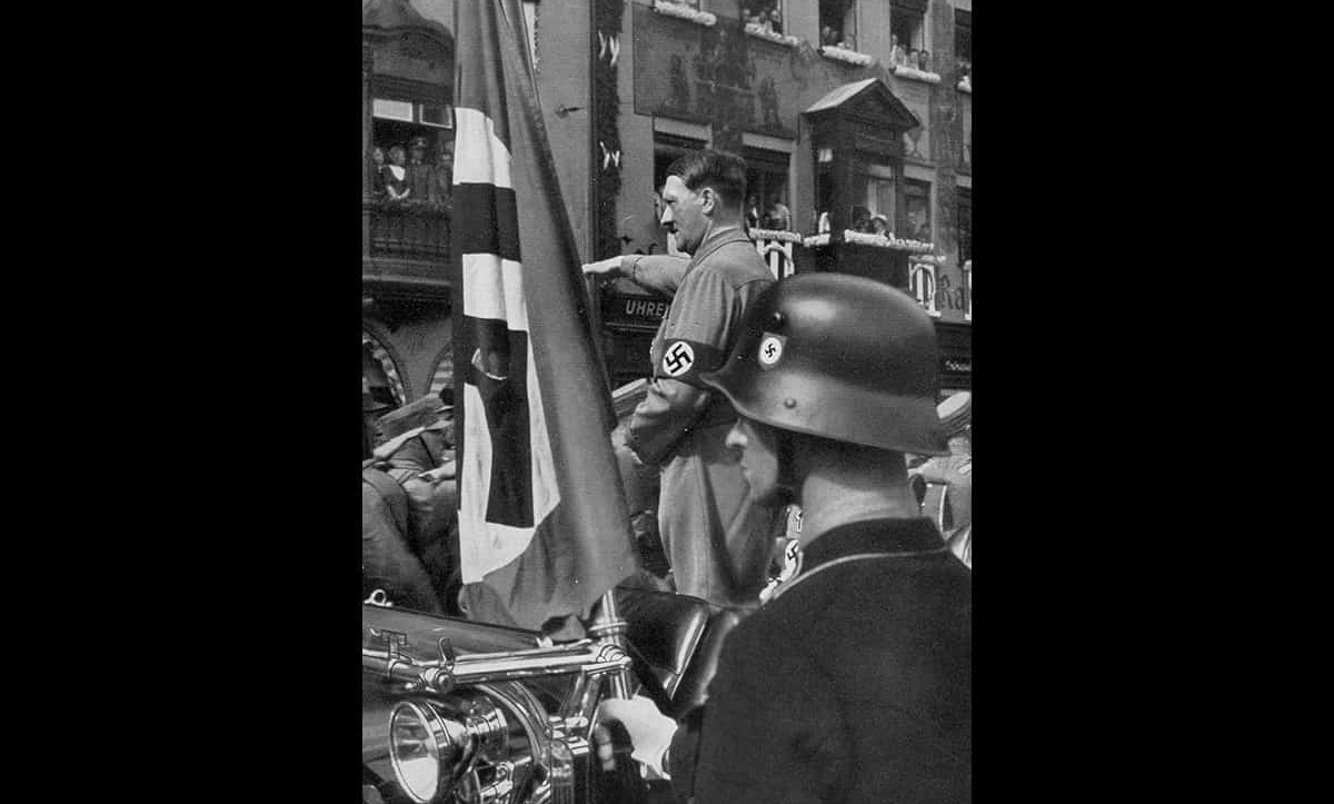 Hitler saluting at a Nuremberg rally in 1923. 'Intentionalist' historians argued that Hitler played a key role in implementing the Final Solution, and that the Holocaust was caused by his personal ideology.