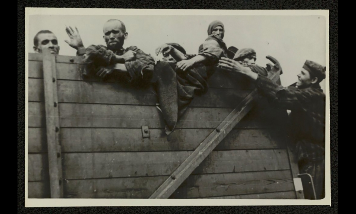 This photograph shows former Buchenwald prisoners after their liberation. They had been evacuated to Theresienstadt at the start of April. Approximately 28,000 inmates of the main camp and 10,000 of the sub-camps were sent on death marches or evacuation transports from Buchenwald, where one in three are estimated to have died. 
